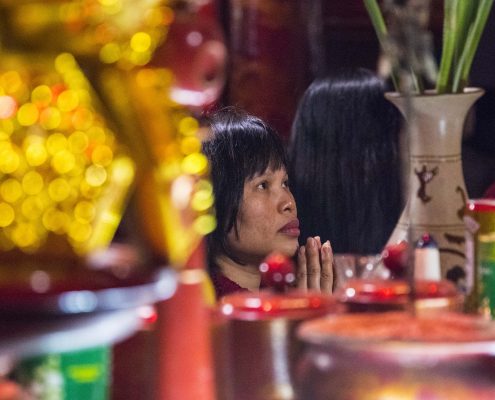 Praying Vietnamese Woman