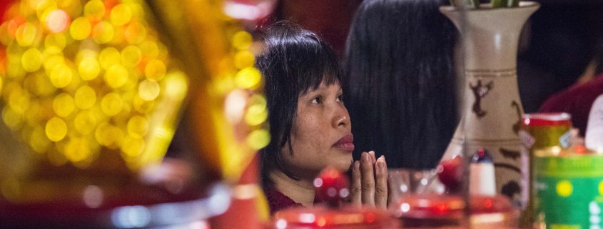 Praying Vietnamese Woman